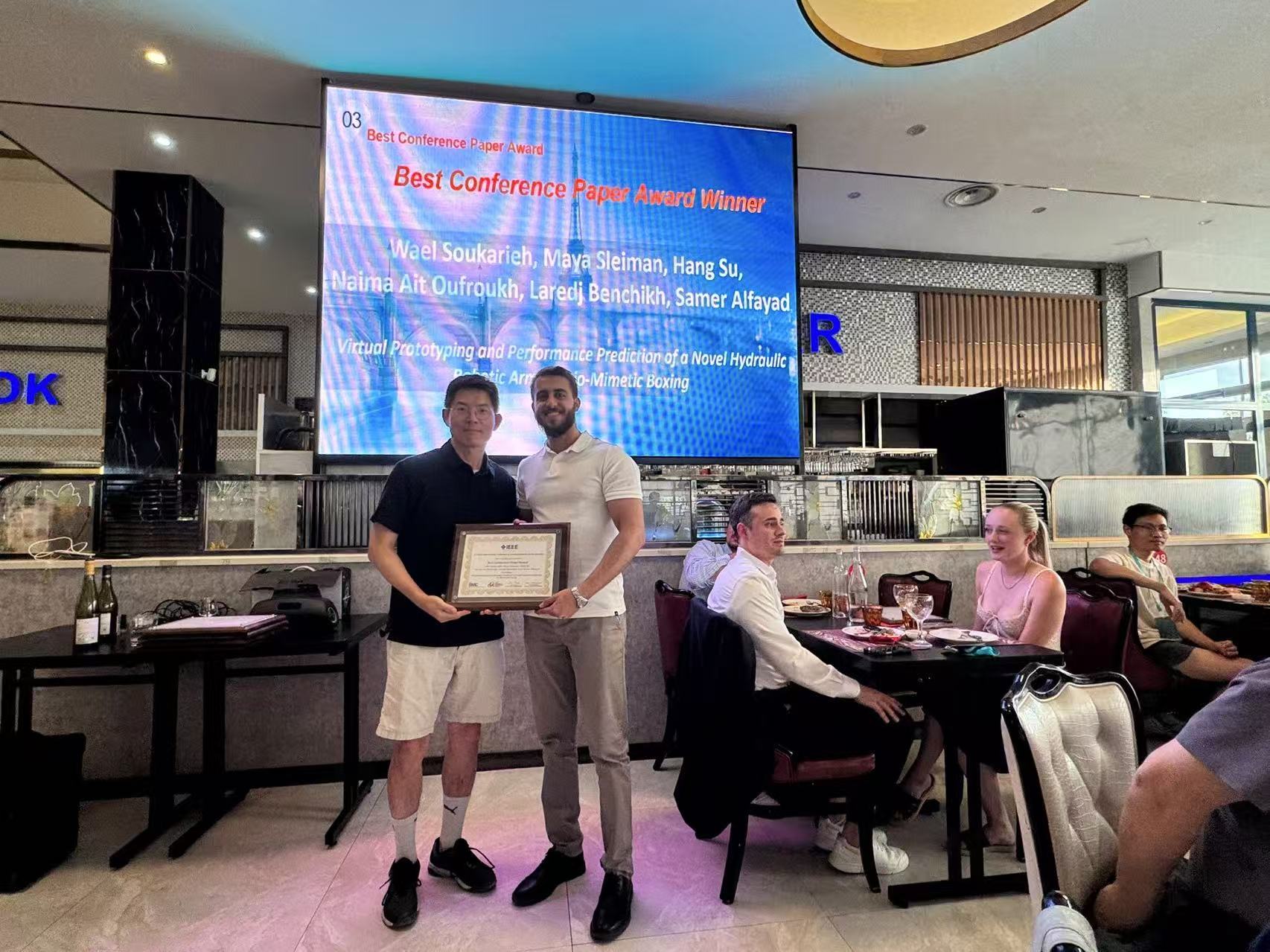Team members holding the Best Conference Paper Award at IEEE ICARM 2026