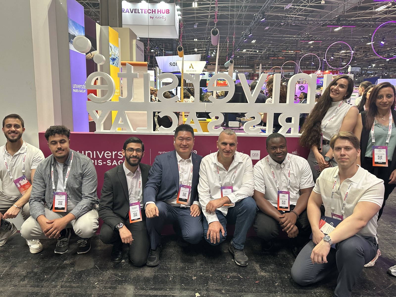 Research team gathered at the Université Paris-Saclay stand during VivaTech 2025
