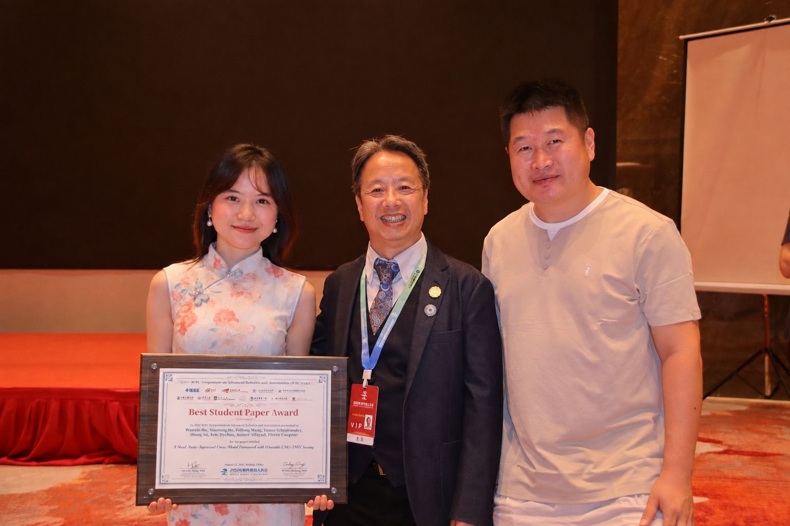 Team members holding the Best Student Paper Award certificate at WRC SARA 2026